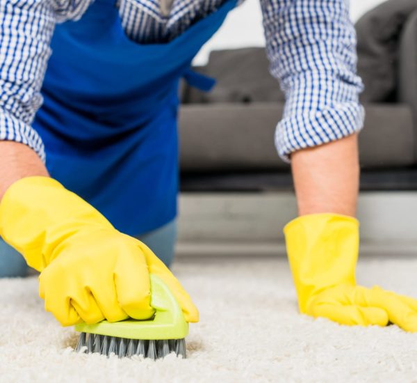 close-up-man-cleaning-his-house