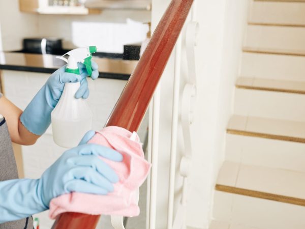 housewife-cleaning-stair-railing