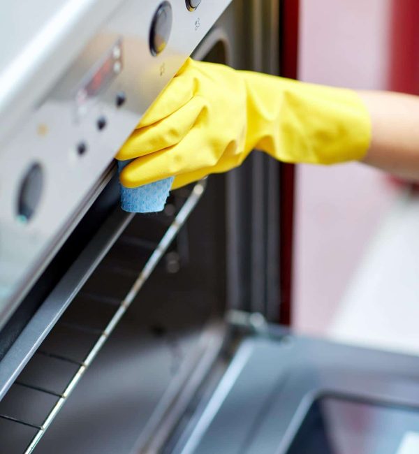 people-housework-housekeeping-concept-close-up-woman-hand-protective-glove-with-rag-cleaning-oven-home-kitchen