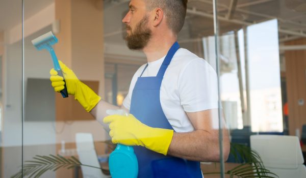 professional-cleaning-service-person-cleaning-office-window3