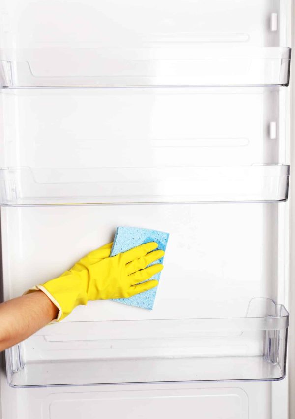 woman-s-hand-washing-refrigerator-with-duster