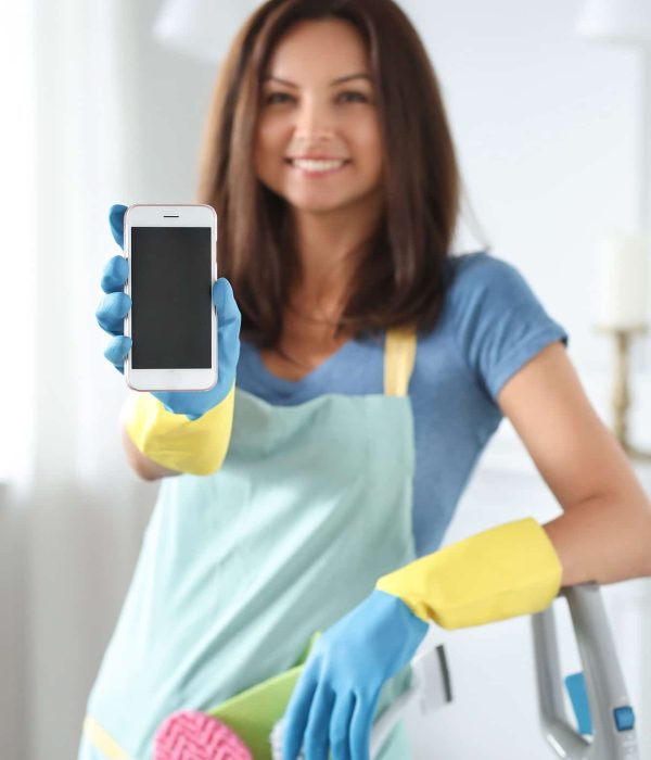 young-woman-with-rubber-gloves-showing-smartphone